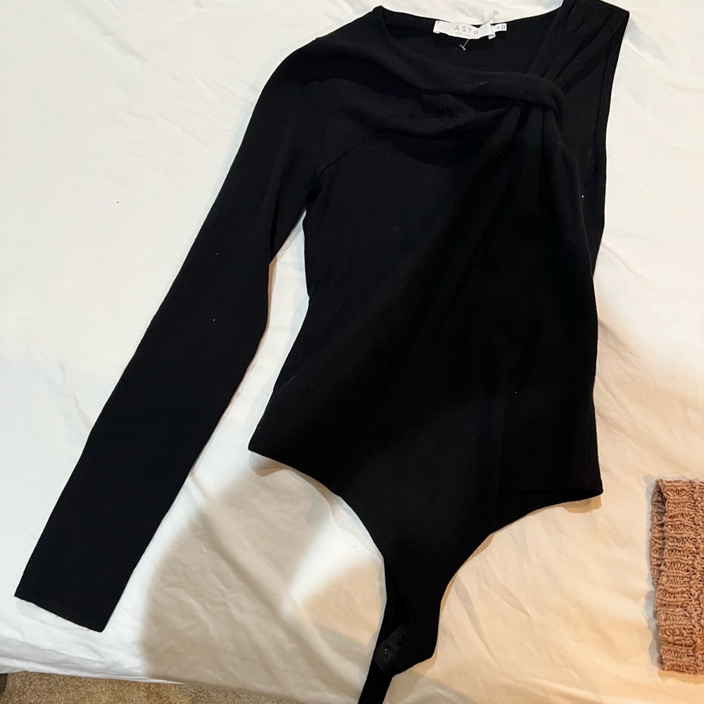 One sleeve one piece that has never been worn!